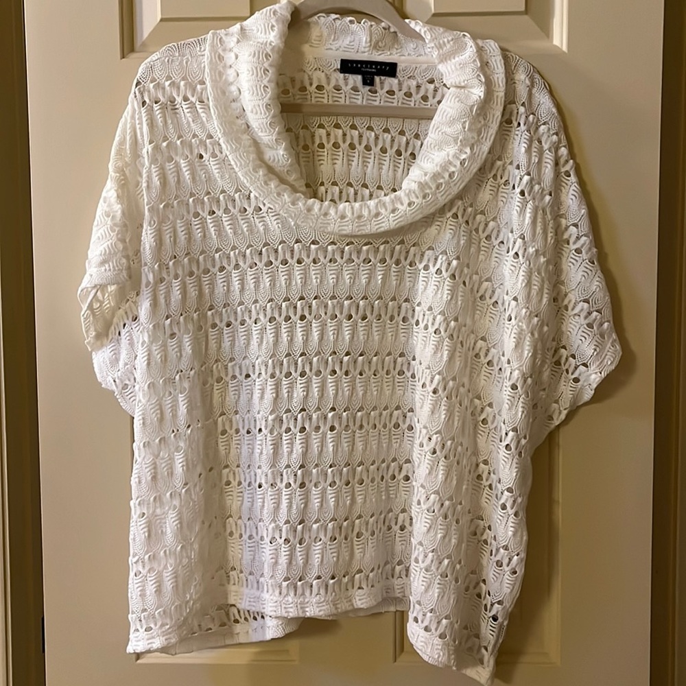 S Sanctuary women’s sweater poncho from Anthropologie.